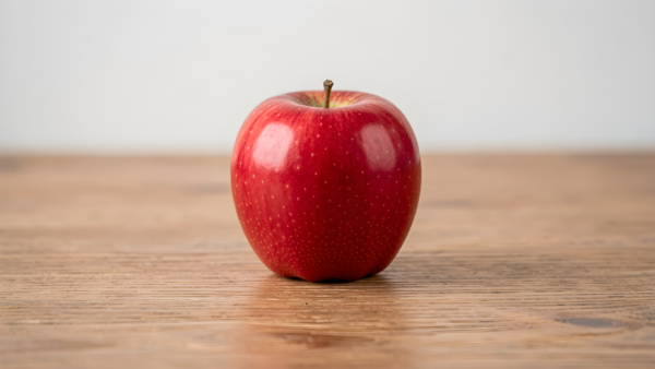 Red apple on wooden table, fresh fruit food photography